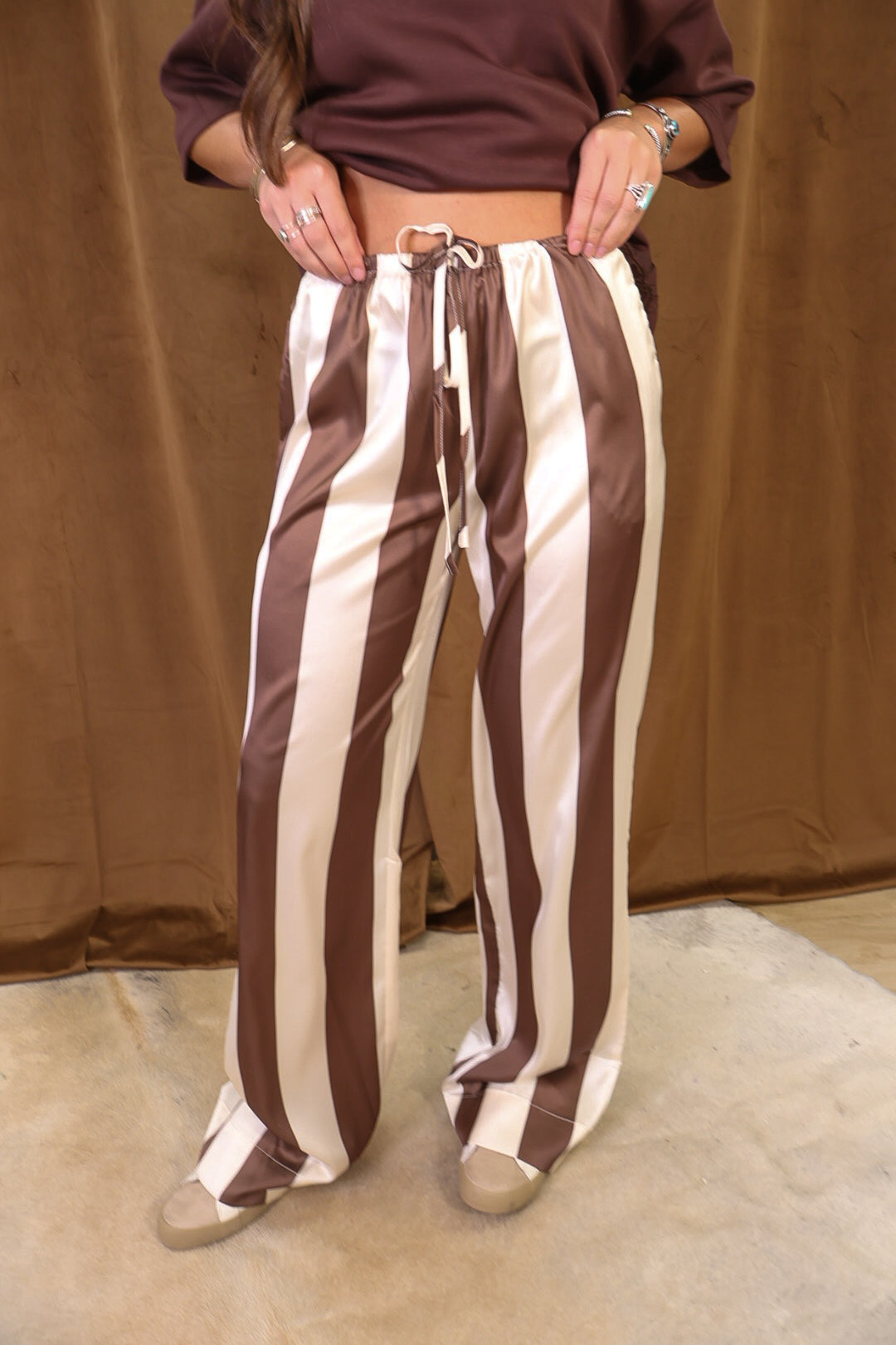 Brown And Cream Satin Striped Wide Leg Pants — front view of brown and cream stripes.