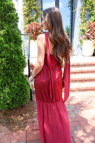 Burgundy satin slip maxi dress with adjustable straps and a detachable neck scarf