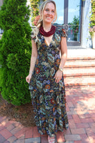 Bohemian floral maxi dress with a V-neck, flutter sleeves, and a tiered ruffle skirt