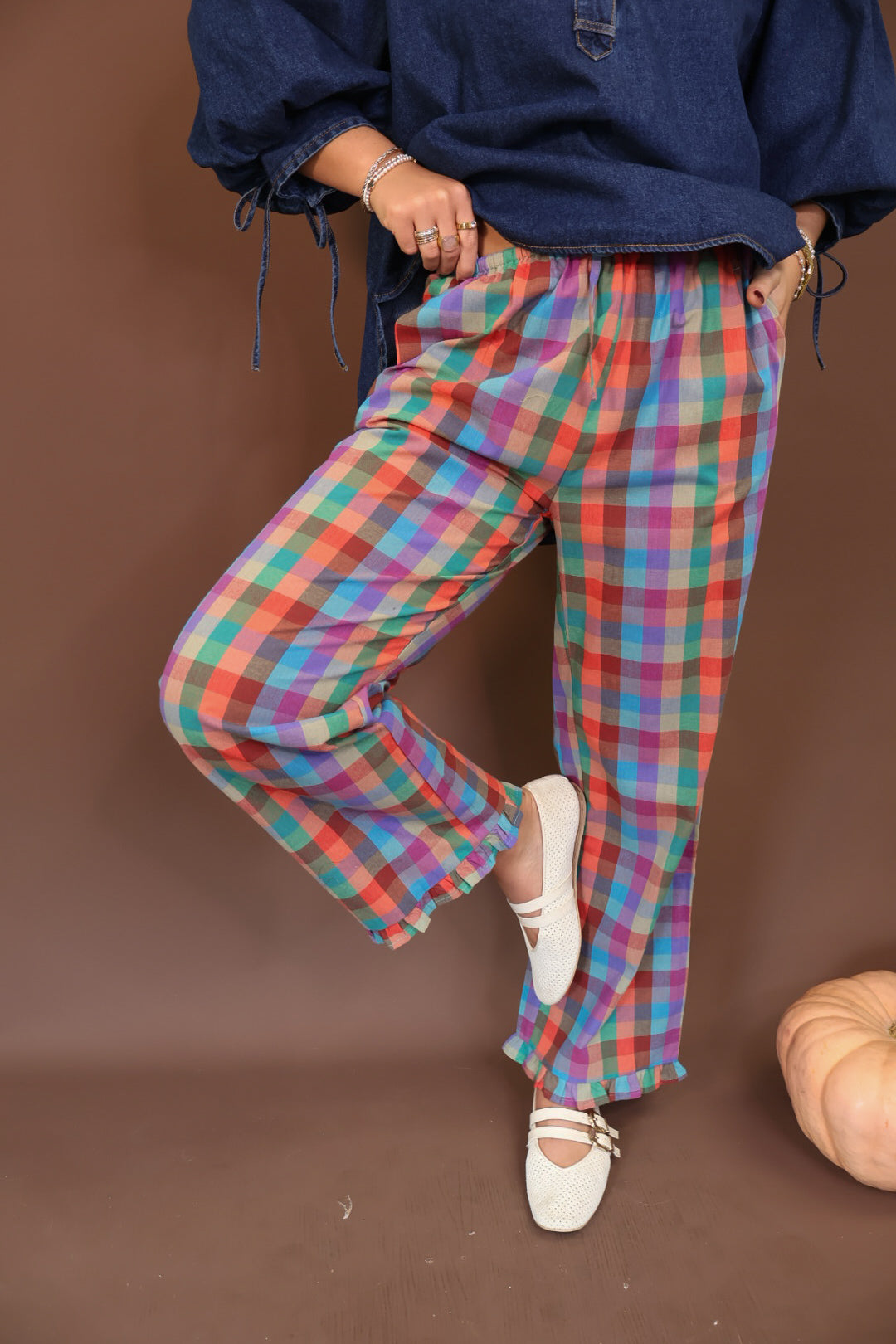 Multicolor Plaid Ruffle Hem Pants — side view of relaxed pant legs.