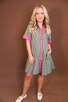 Model wearing the Olive Striped Button Front Dress from Moda Boutique