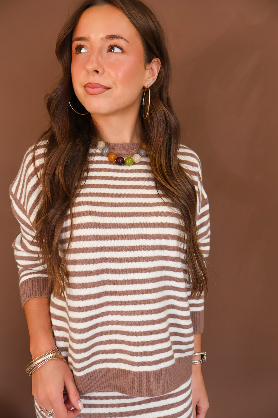 Hazelnut Striped Sweater And Mini Skirt Set — close-up of sweater neckline and stripes.