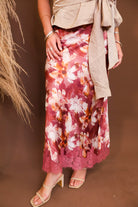 Model wearing the Mauve Floral Satin Midi Skirt from Moda Boutique