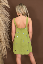 Model wearing the Chartreuse Mirrored Sequin Shift Dress from Moda Boutique