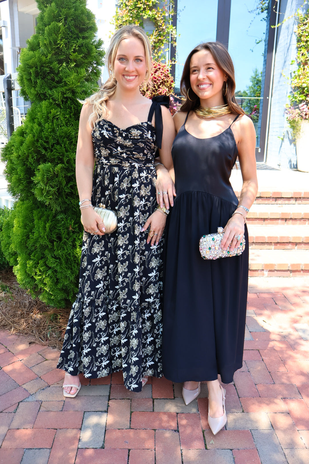 Black satin cami maxi dress with a scooped neck and flowy gathered skirt