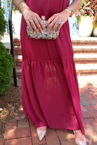 Burgundy satin slip maxi dress with adjustable straps and a detachable neck scarf
