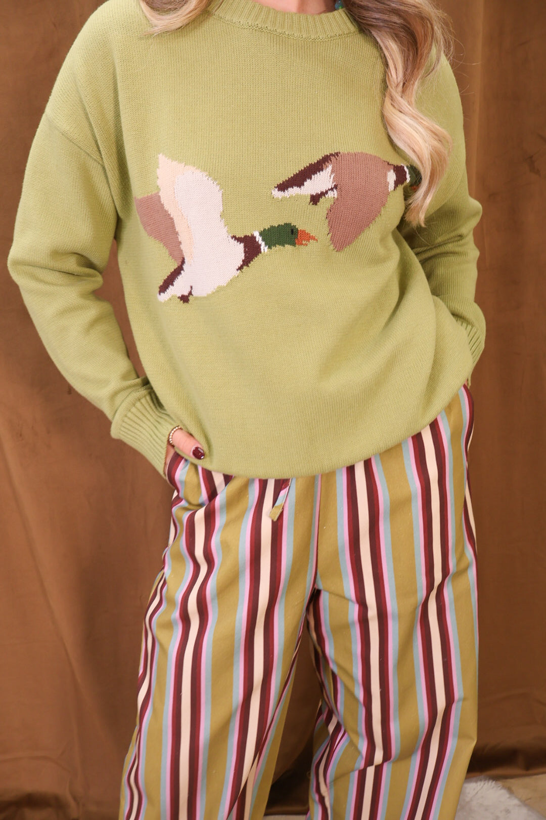 Green Flying Mallards Sweater — close-up of mallard motif.
