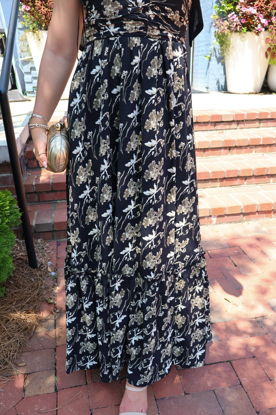 Black maxi dress with gold floral embroidery and ribbon shoulder ties
