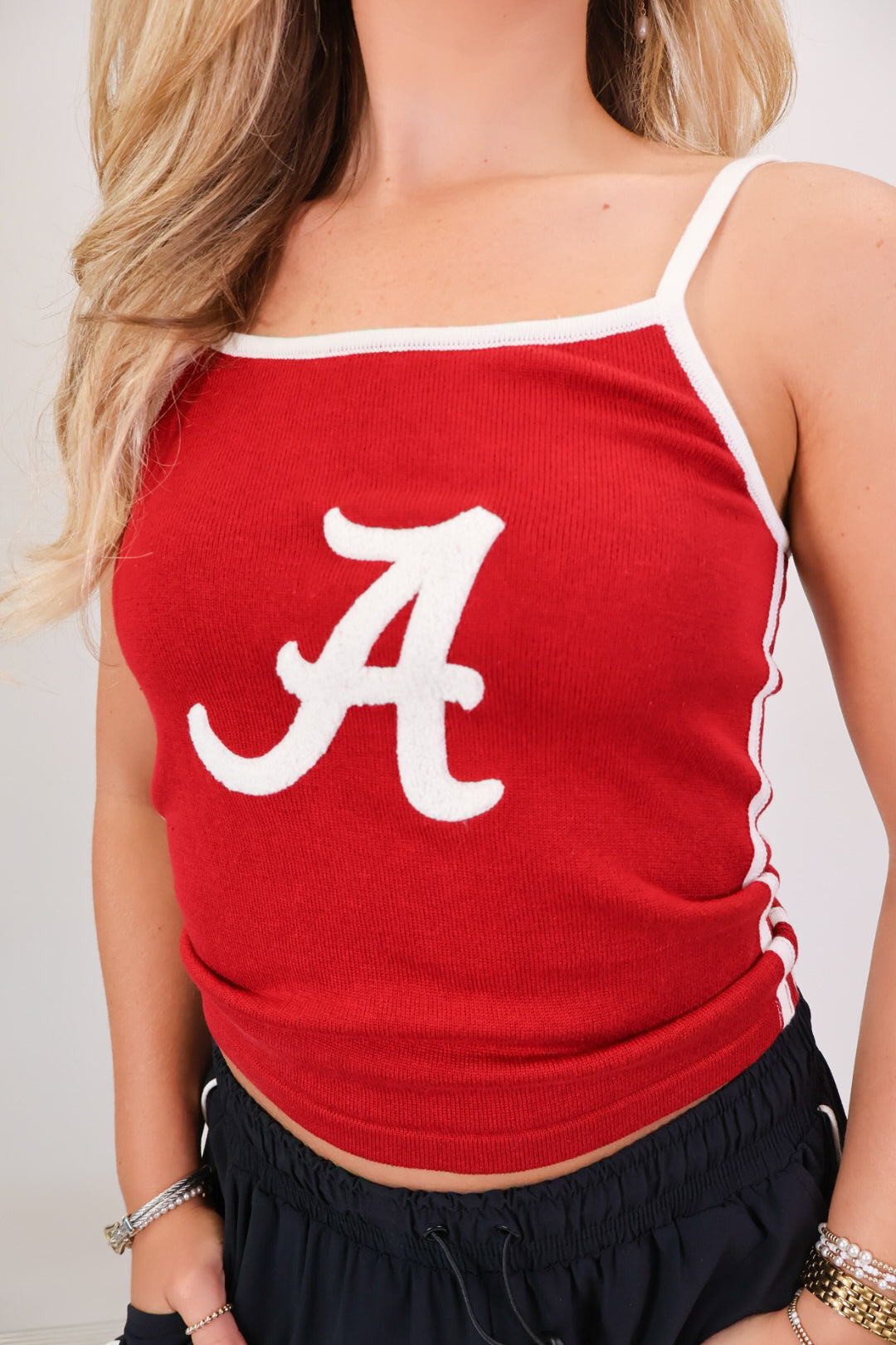 Crimson knit tank top with white script A and adjustable straps — view 4