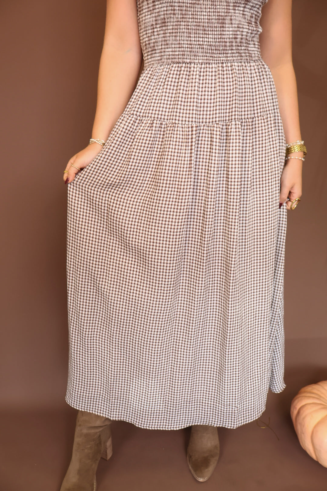 Brown Gingham Smocked Sleeveless Midi Dress — close-up of gathered skirt.
