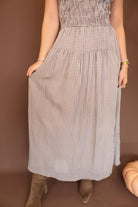 Brown Gingham Smocked Sleeveless Midi Dress — close-up of gathered skirt.
