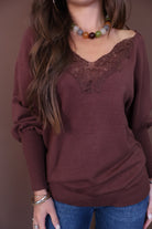 Brown Lace Neckline Sweater — close-up of lace-trimmed V-neckline.