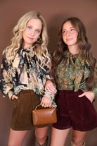 Black Floral Tie-Front Blouse — shown beside an olive floral blouse.