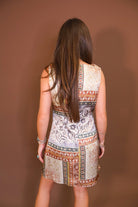 Model wearing the Patchwork Printed Satin Cowl Neck Mini Dress from Moda Boutique