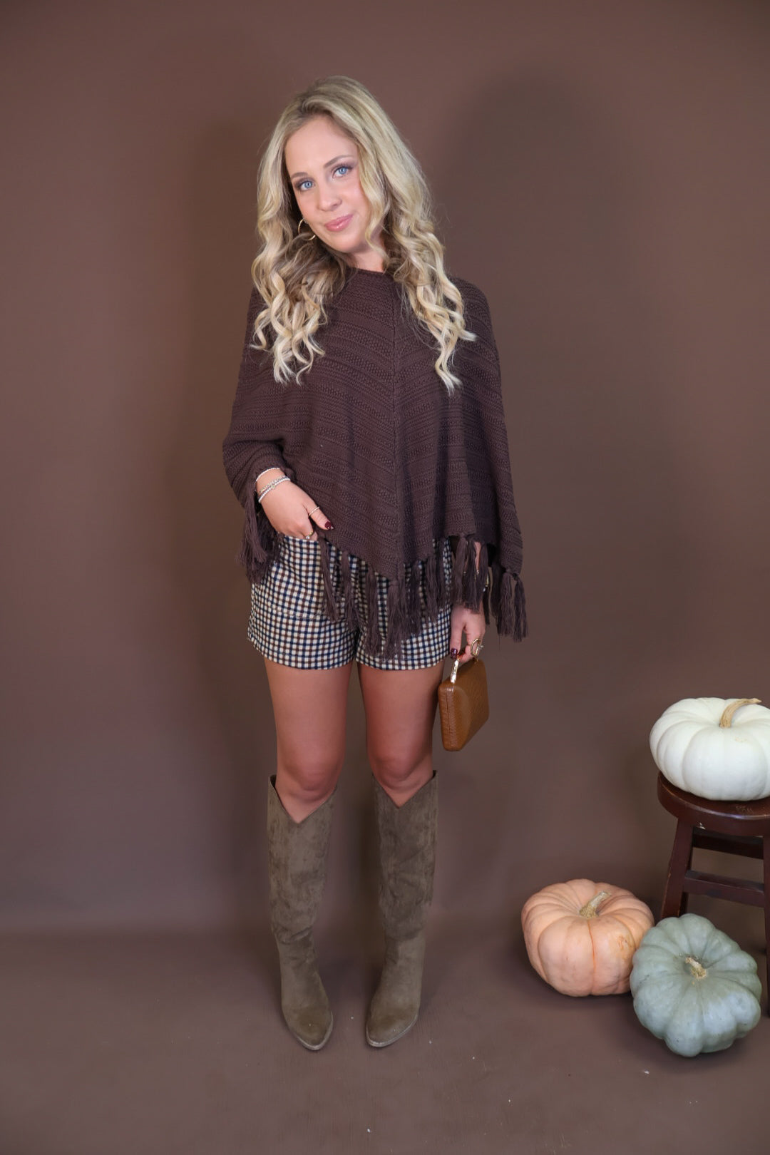 Chocolate Brown Crochet Fringe Poncho Top — full outfit with plaid shorts.