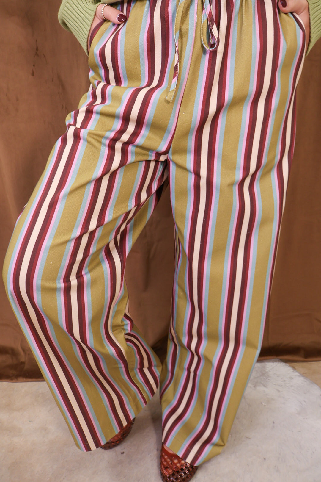 Multicolor Striped Wide Leg Pants — close-up of multicolor stripes and wide legs.