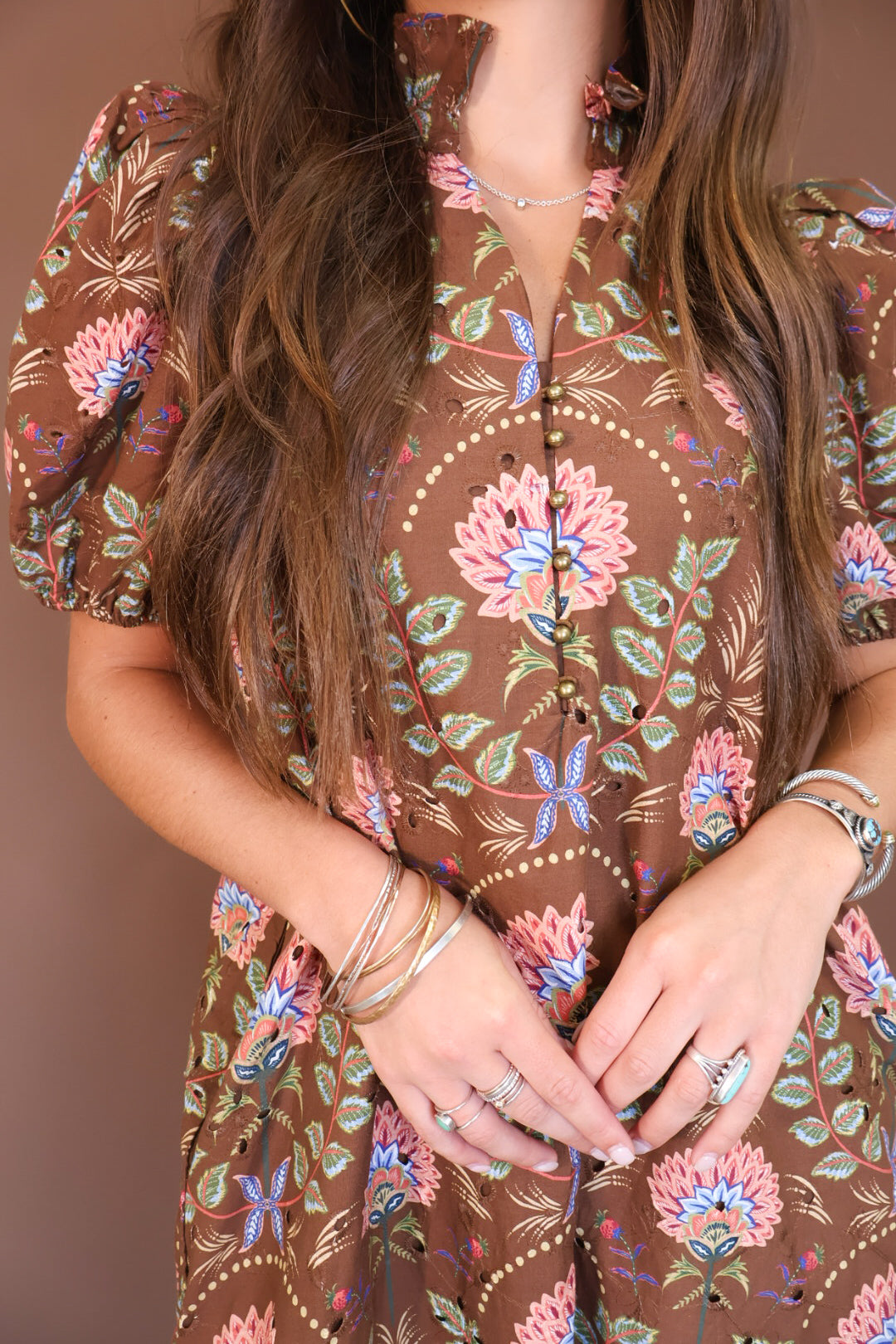 Brown Floral Eyelet Midi Dress — close-up of floral print and neckline.