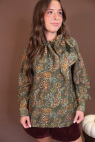 Olive Floral Tie-Neck Blouse — front view with ties hanging loose.