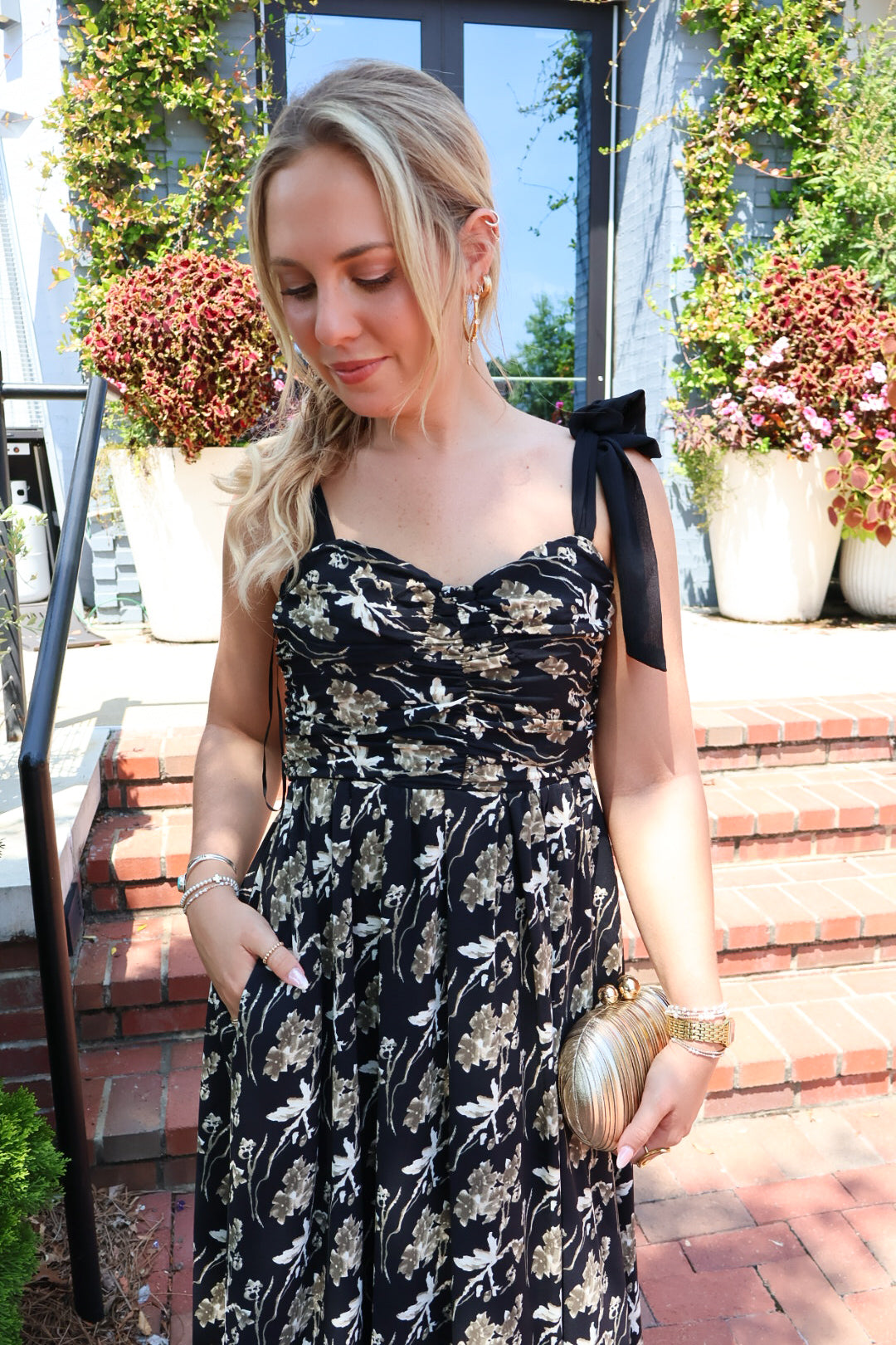 Black maxi dress with gold floral embroidery and ribbon shoulder ties