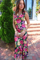 Black floral satin maxi dress with twisted straps and a draped cowl neckline