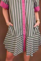 Model wearing the Olive Striped Button Front Dress from Moda Boutique