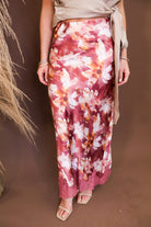 Model wearing the Mauve Floral Satin Midi Skirt from Moda Boutique