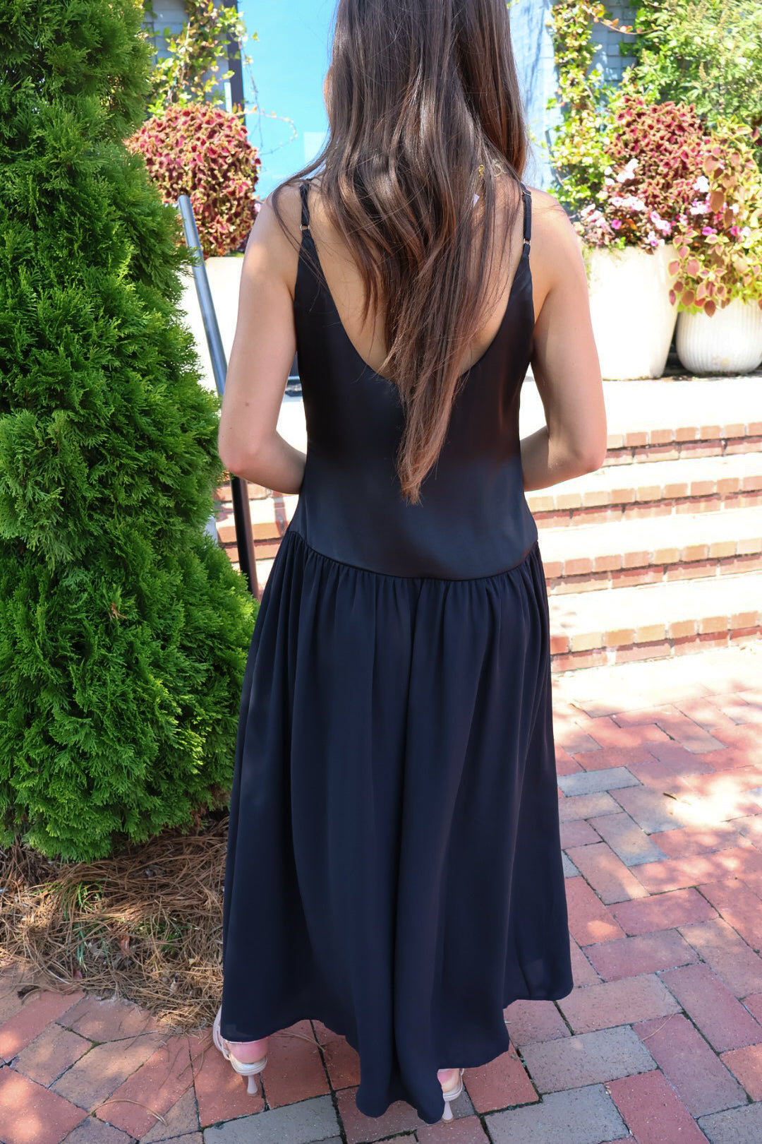 Black satin cami maxi dress with a scooped neck and flowy gathered skirt