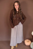 Chocolate Brown Button-Front Cardigan — full outfit layered over a dress.