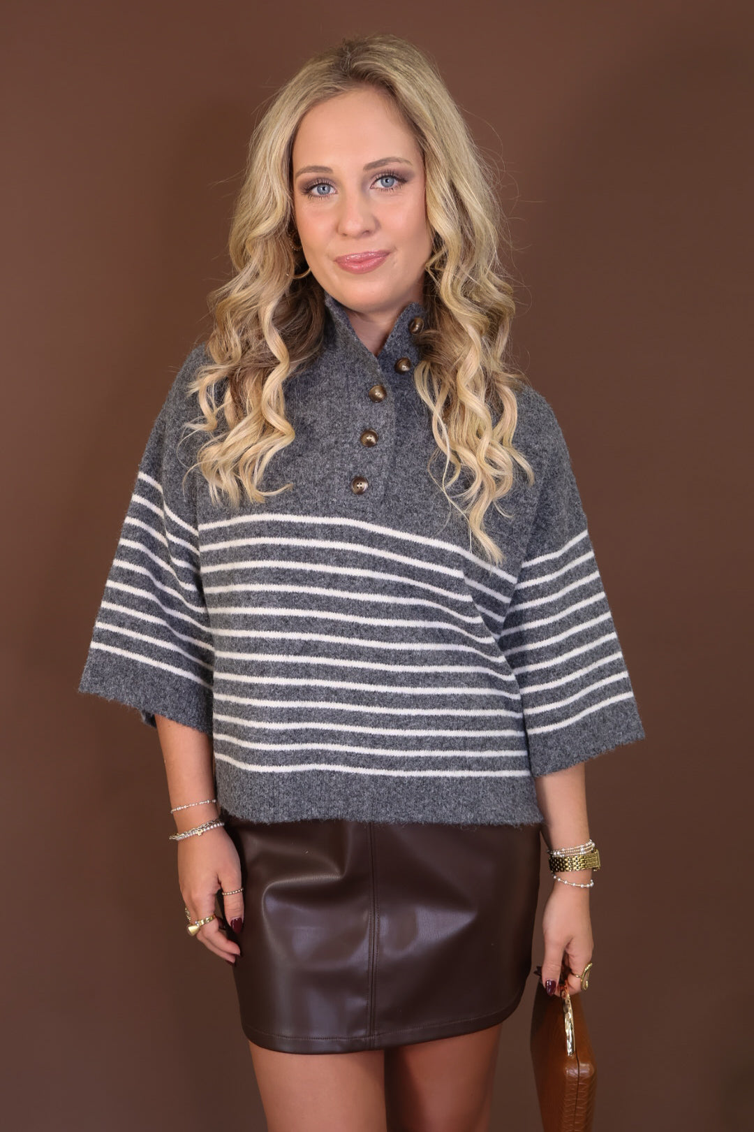 Gray Striped Henley Sweater — front view with striped body and button neckline.