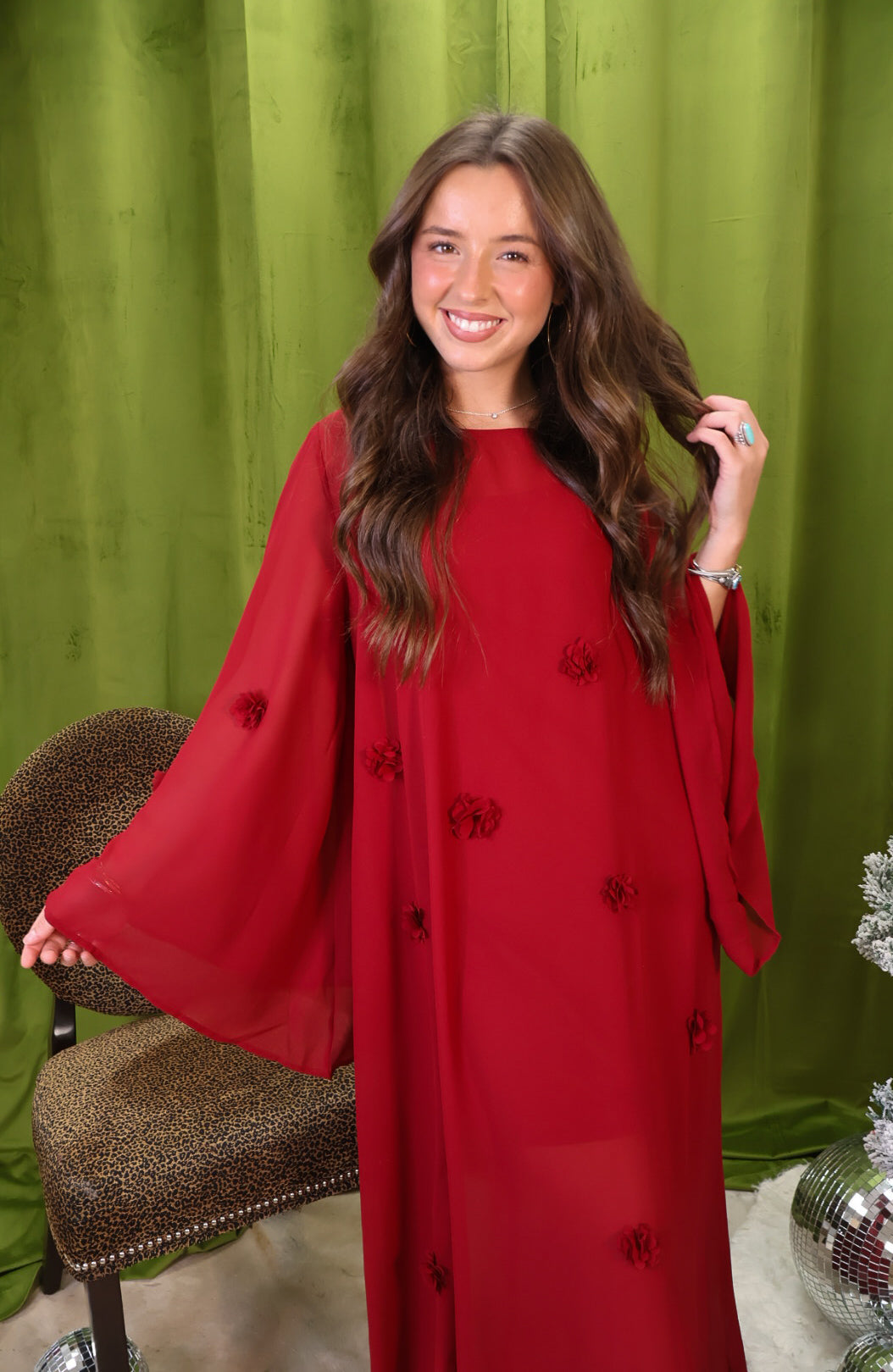 Crimson Flower Applique Maxi Dress – front view with sleeves extended.